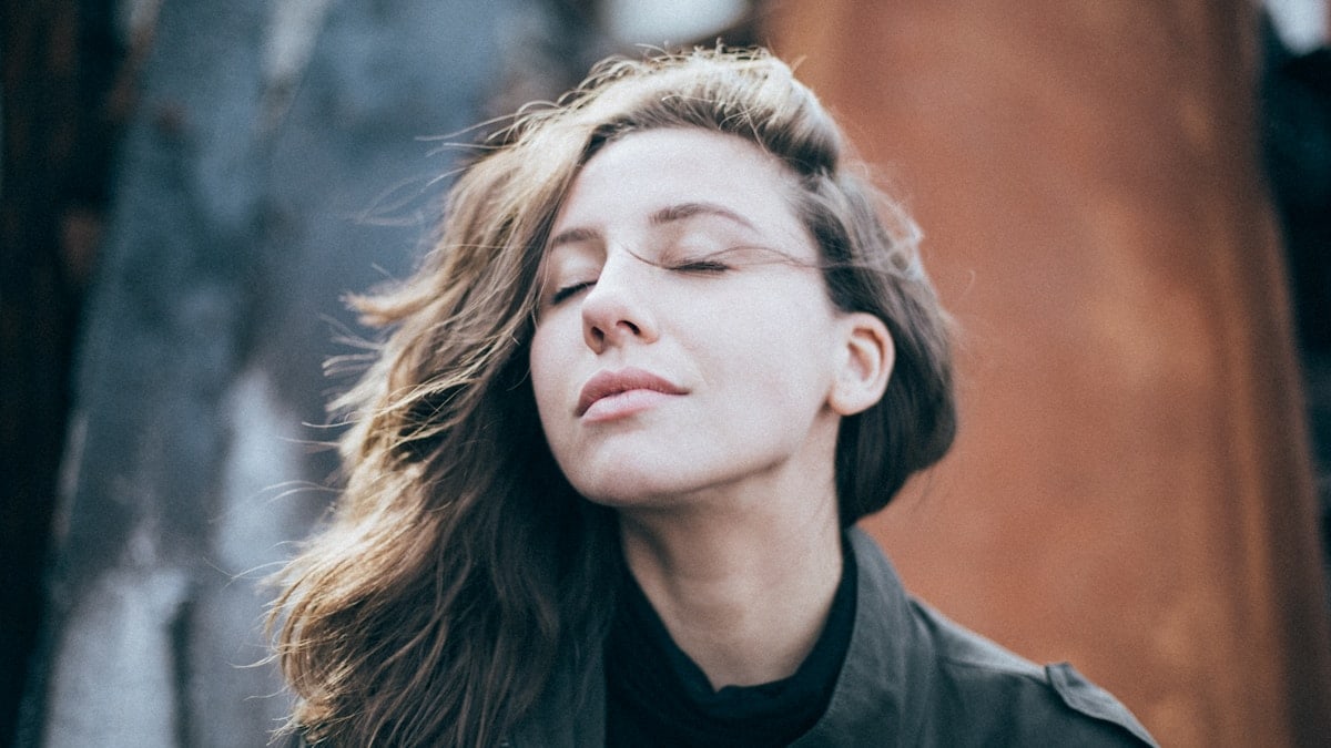 closeup photo of woman wearing black top